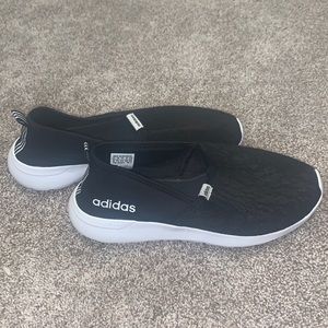 Black and White Adidas slip-ones.